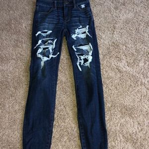 Dark blue ripped jeans